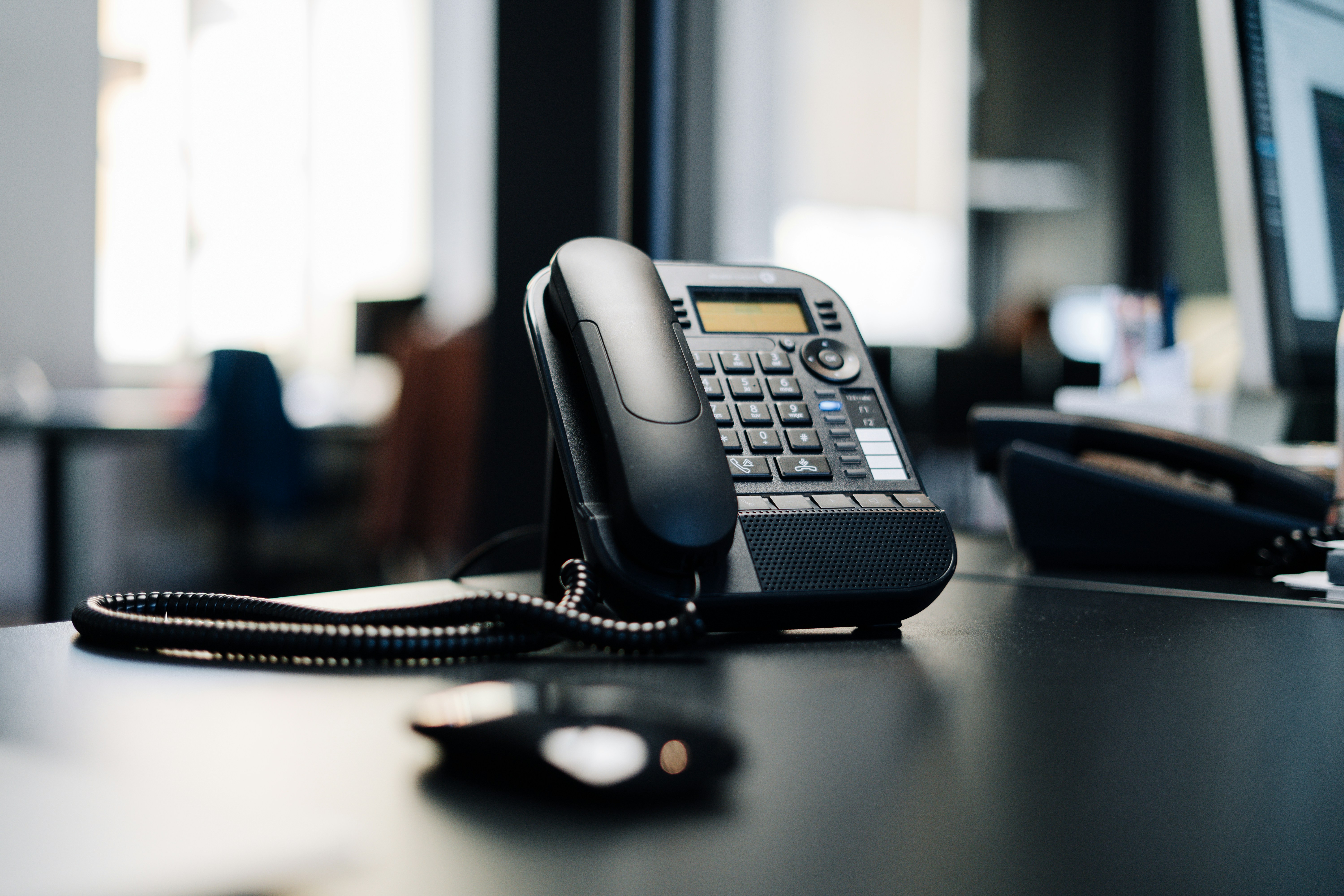 A desk phone — old-fashioned, still answers